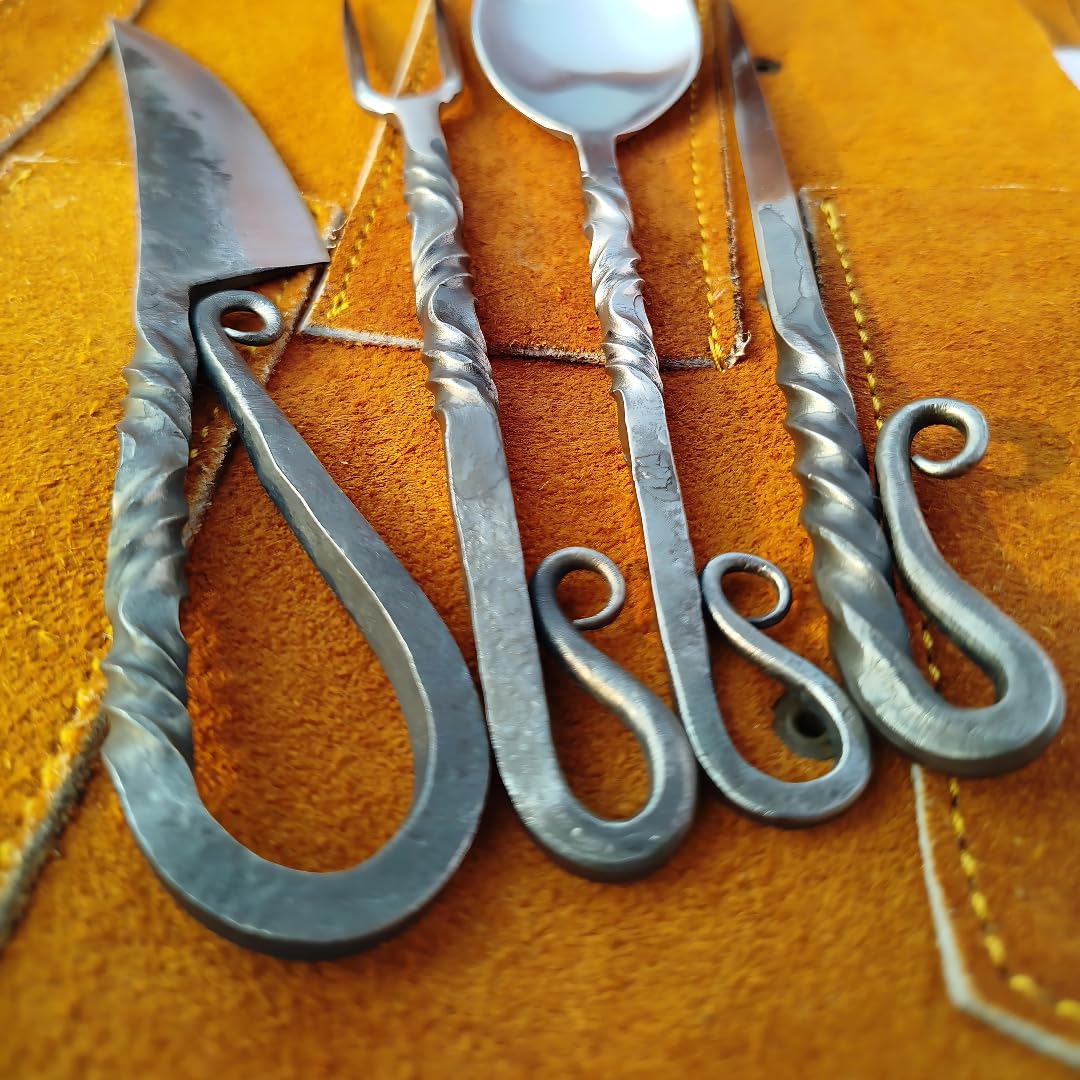 Generic hand forged silverware on dining table enhances modern and historic setups.