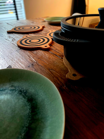 Generic magnet cork-trivet on countertop protecting surfaces from heat
