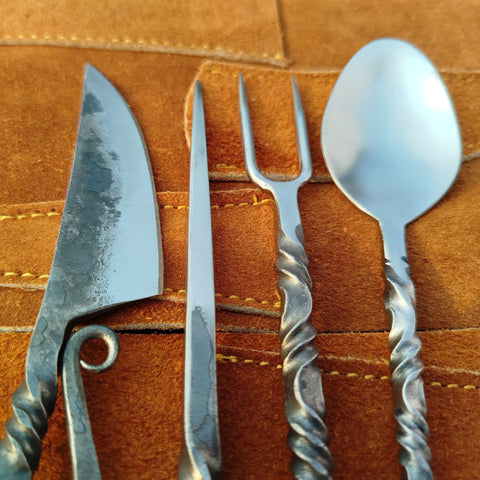 Generic Viking-era silverware collection on the table adds historical charm.