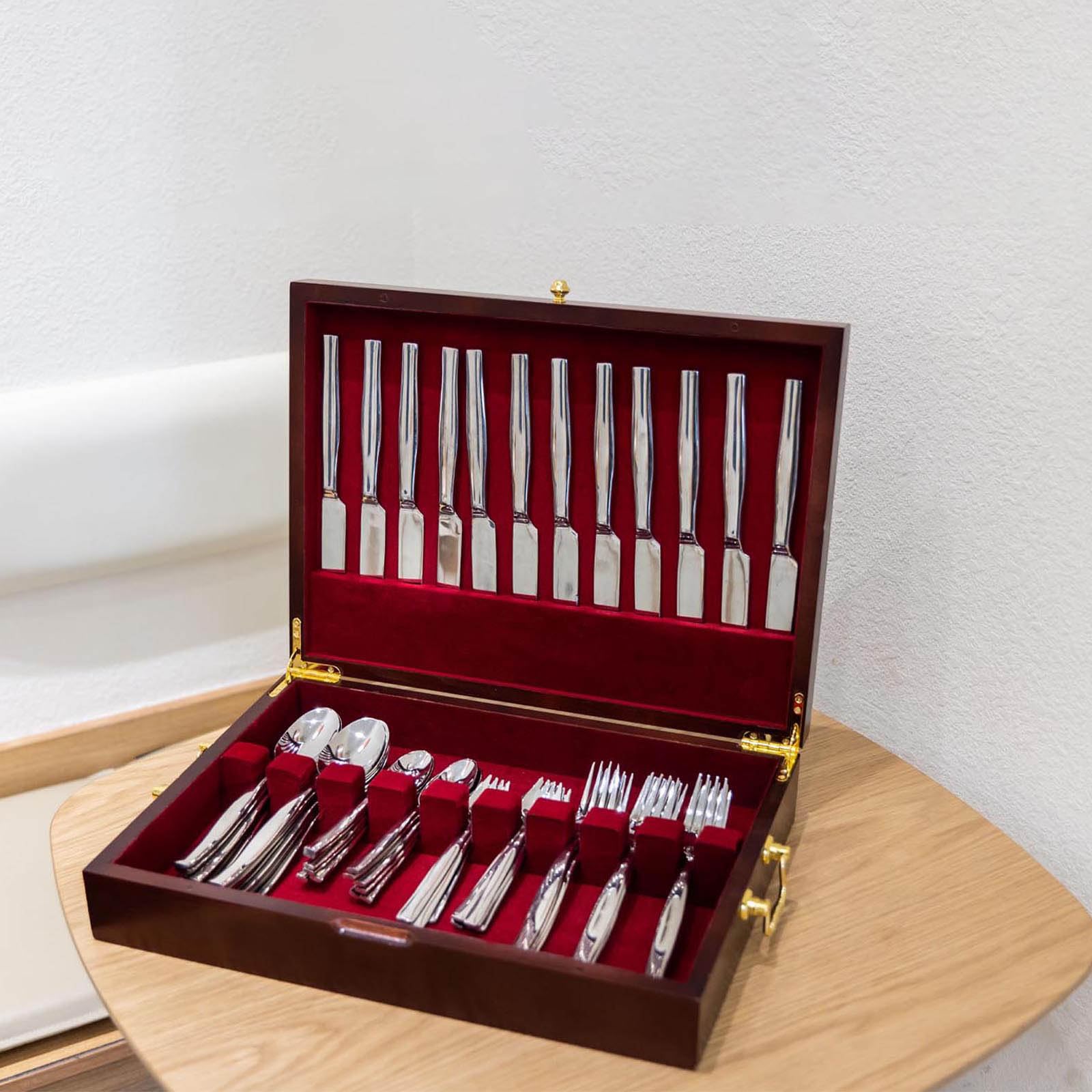 GENRICE wooden silverware chest serves as an elegant display on the cabinet