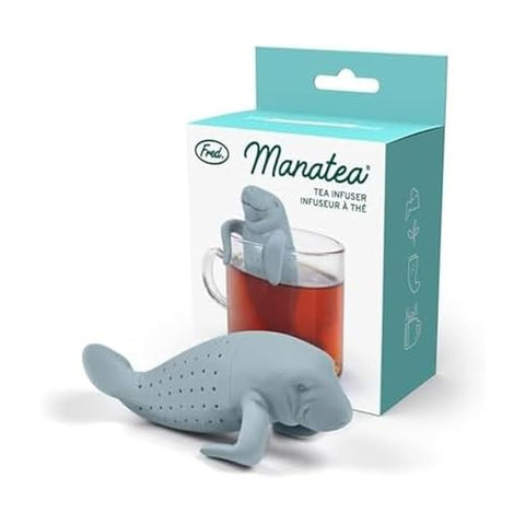 Genuine Fred MANATEA infuser perched on a mug rim for easy, mess-free steeping.