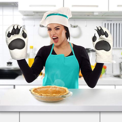 Using Genuine Fred mitts to pull a hot tray from the oven.