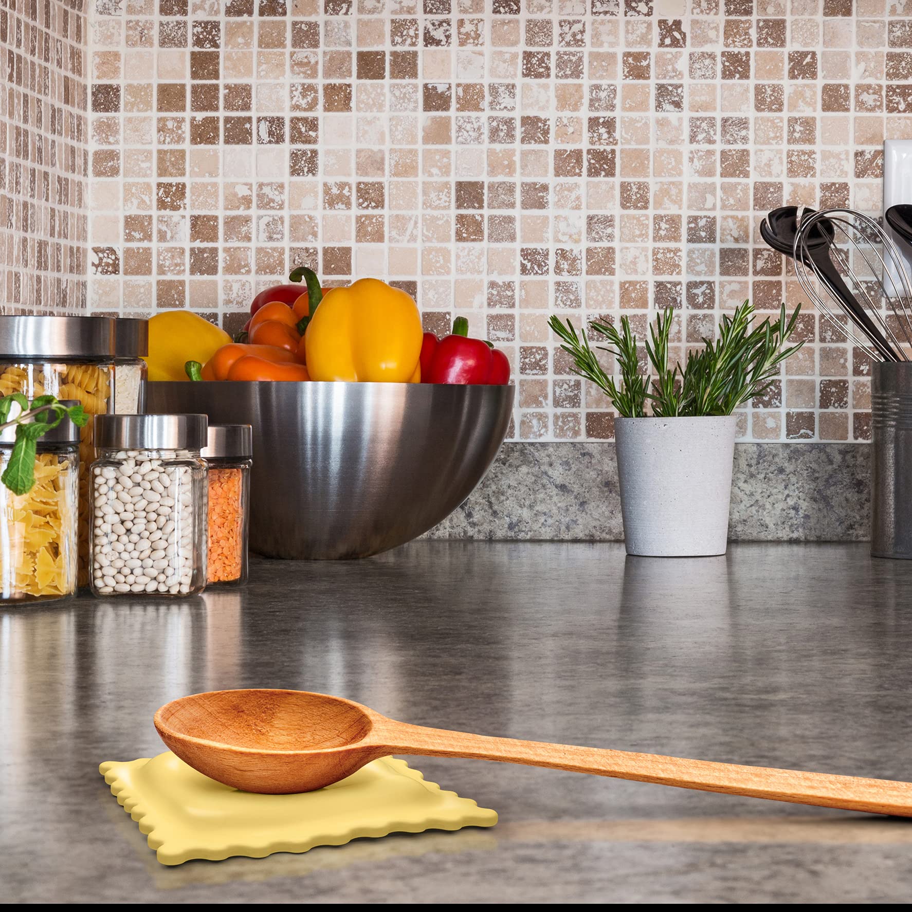 Genuine Fred SAUCED UP Ravioli Spoon Rest on countertop catching sauce