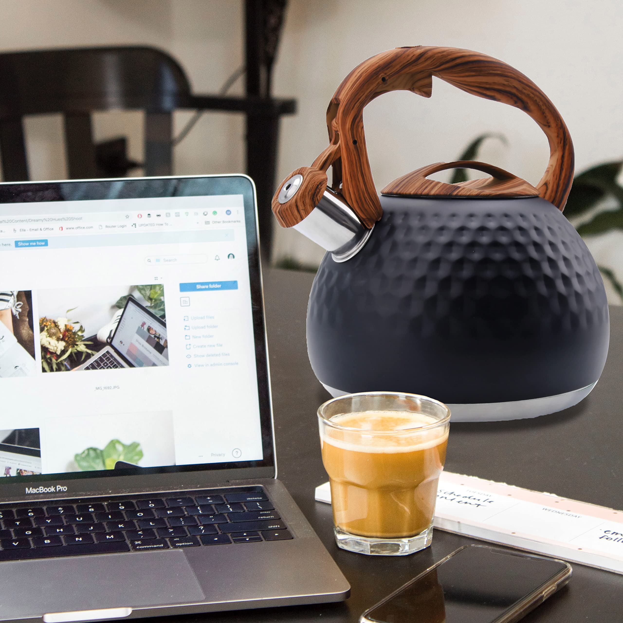 GGC tea kettle with wood-pattern handle offers comfortable grip while pouring.