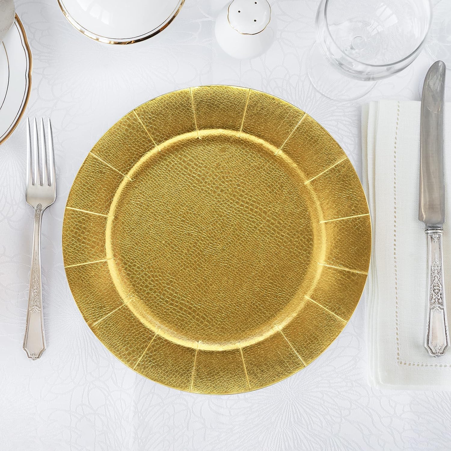 Gift Boutique gold pebbled charger complements any color scheme for weddings.