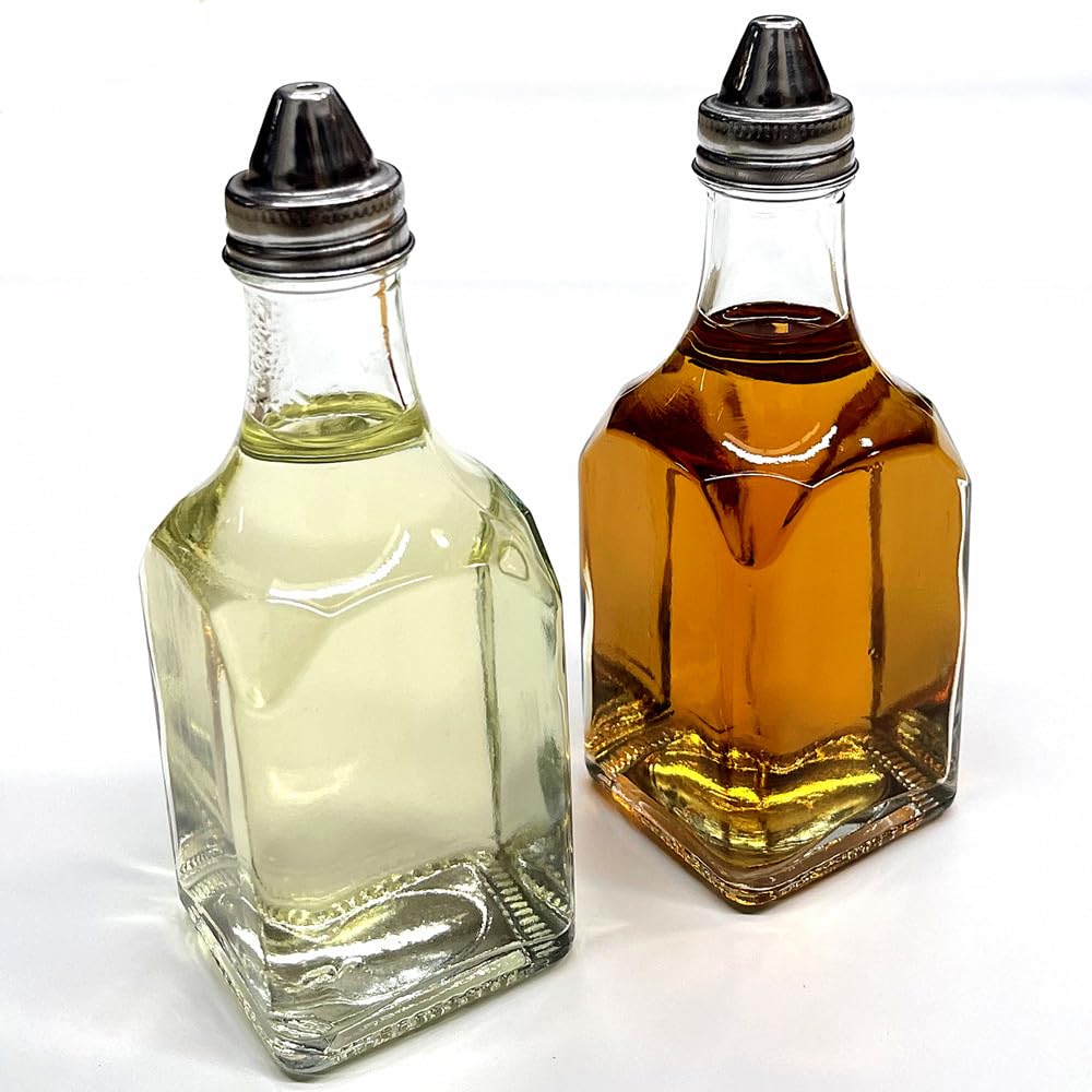 Glass oil and vinegar dispenser set with square bottles for organized countertops and easy pouring