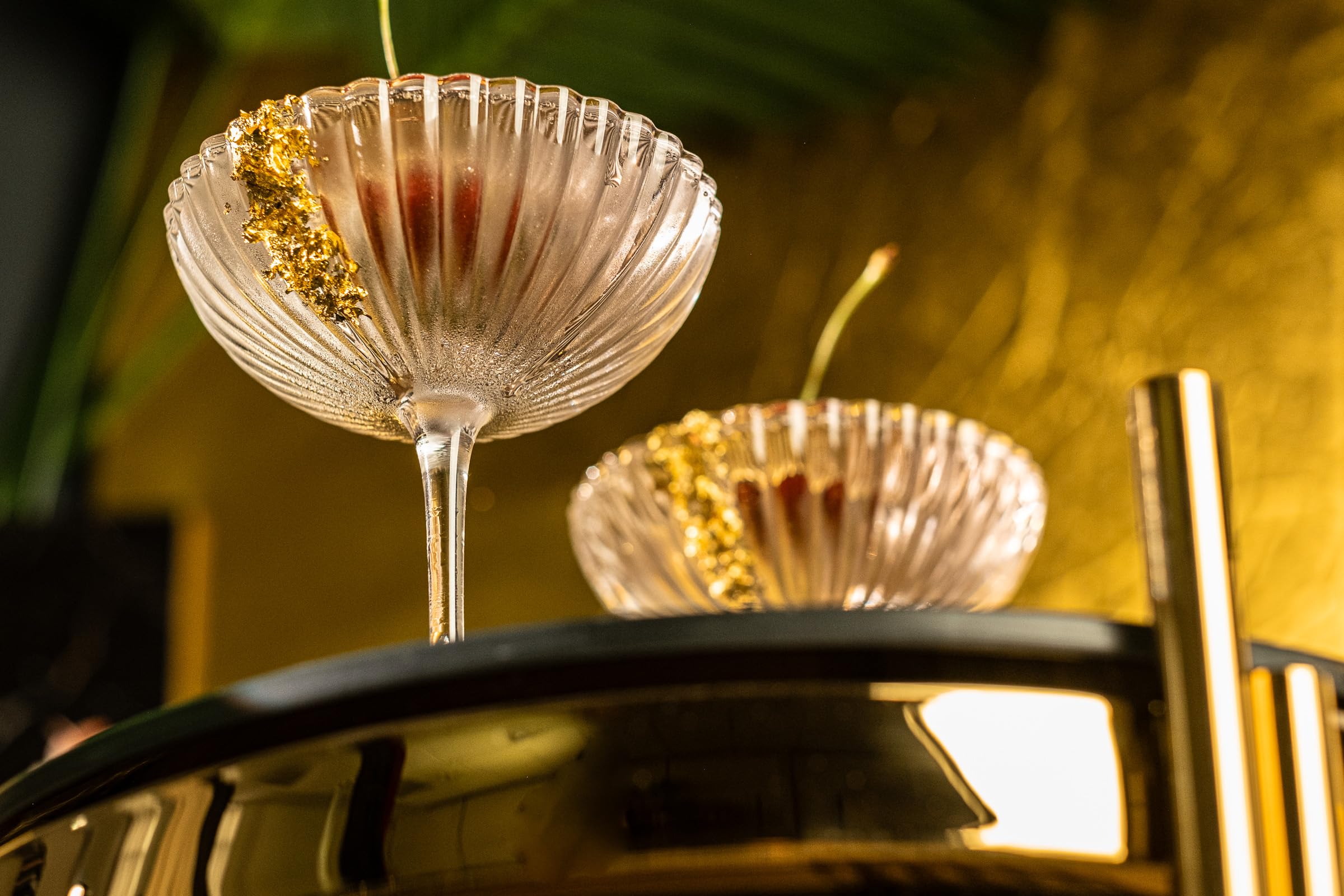 Venus Seashell Coupe, hand-blown crystal, enhances presentation for upscale cocktails.
