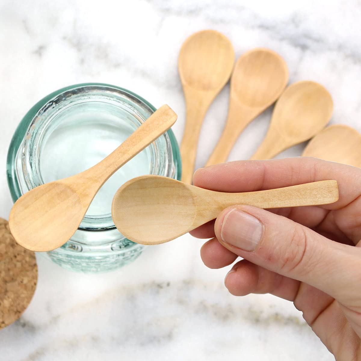 Gleihow spoons beside spice jars showing versatile kitchen scooping