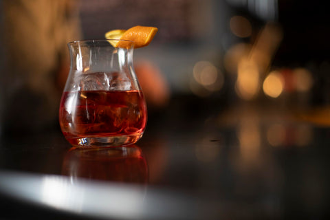 Glencairn mixer glass with ice and garnish for ideal serve setup