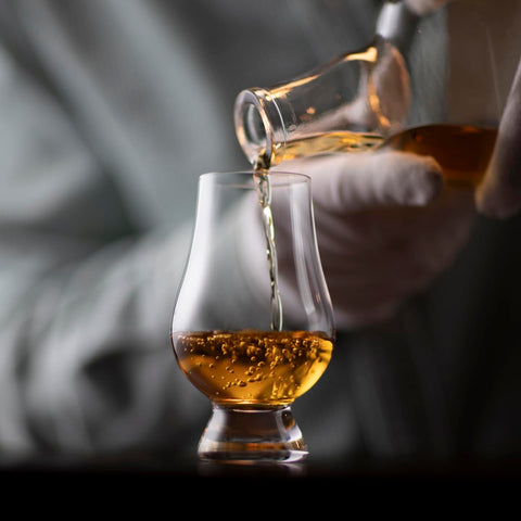 Glencairn whiskey glass close-up emphasizing lead-free crystal brilliance.
