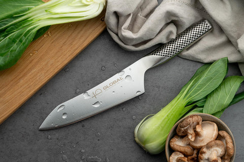 Global 40th anniversary 7-inch knife showing ergonomic handle for comfortable chopping