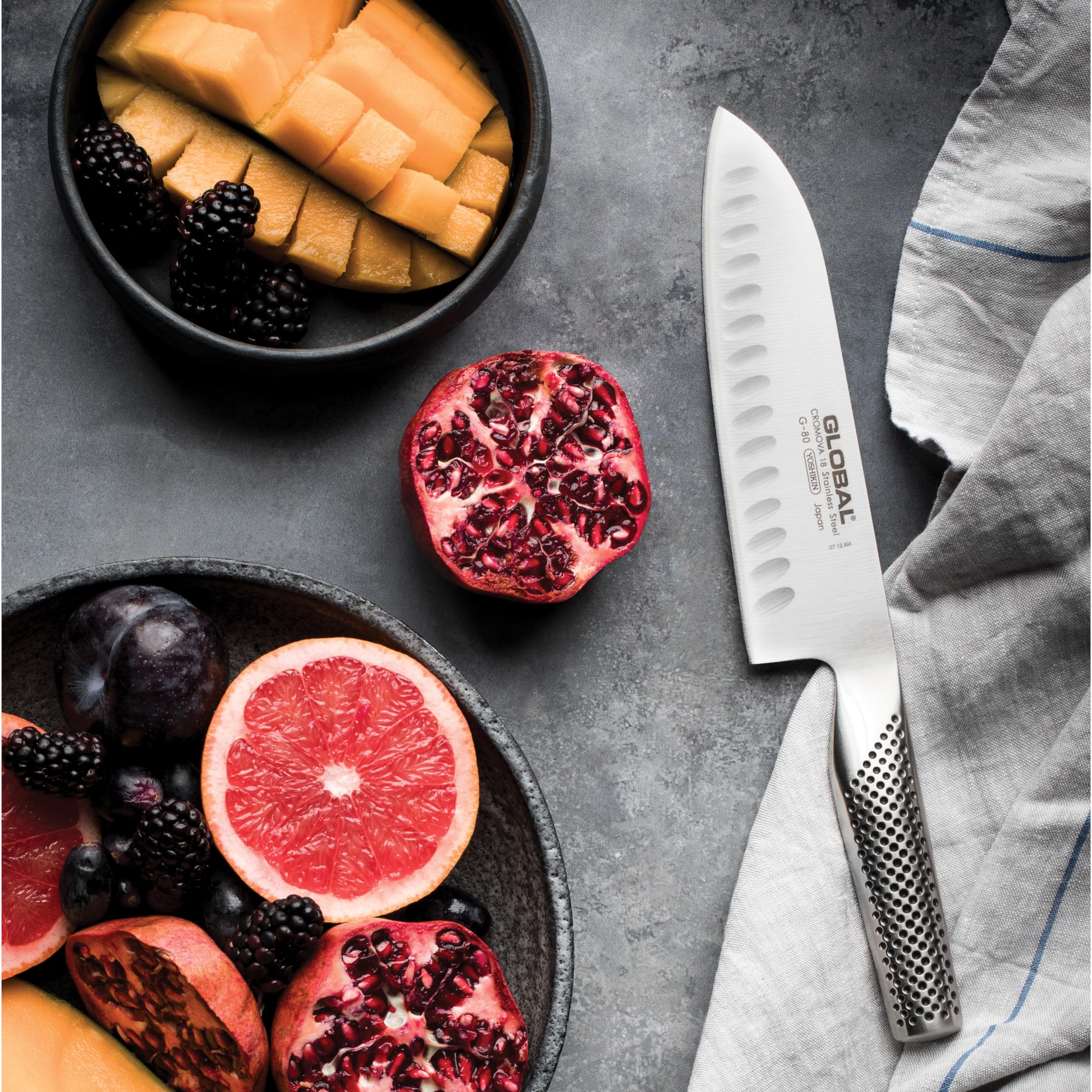 Global 7-inch Santoku in action for vegetables and seafood prep