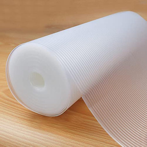 Glomen refrigerator liner roll on a shelf prevents spills and keeps surfaces clean.