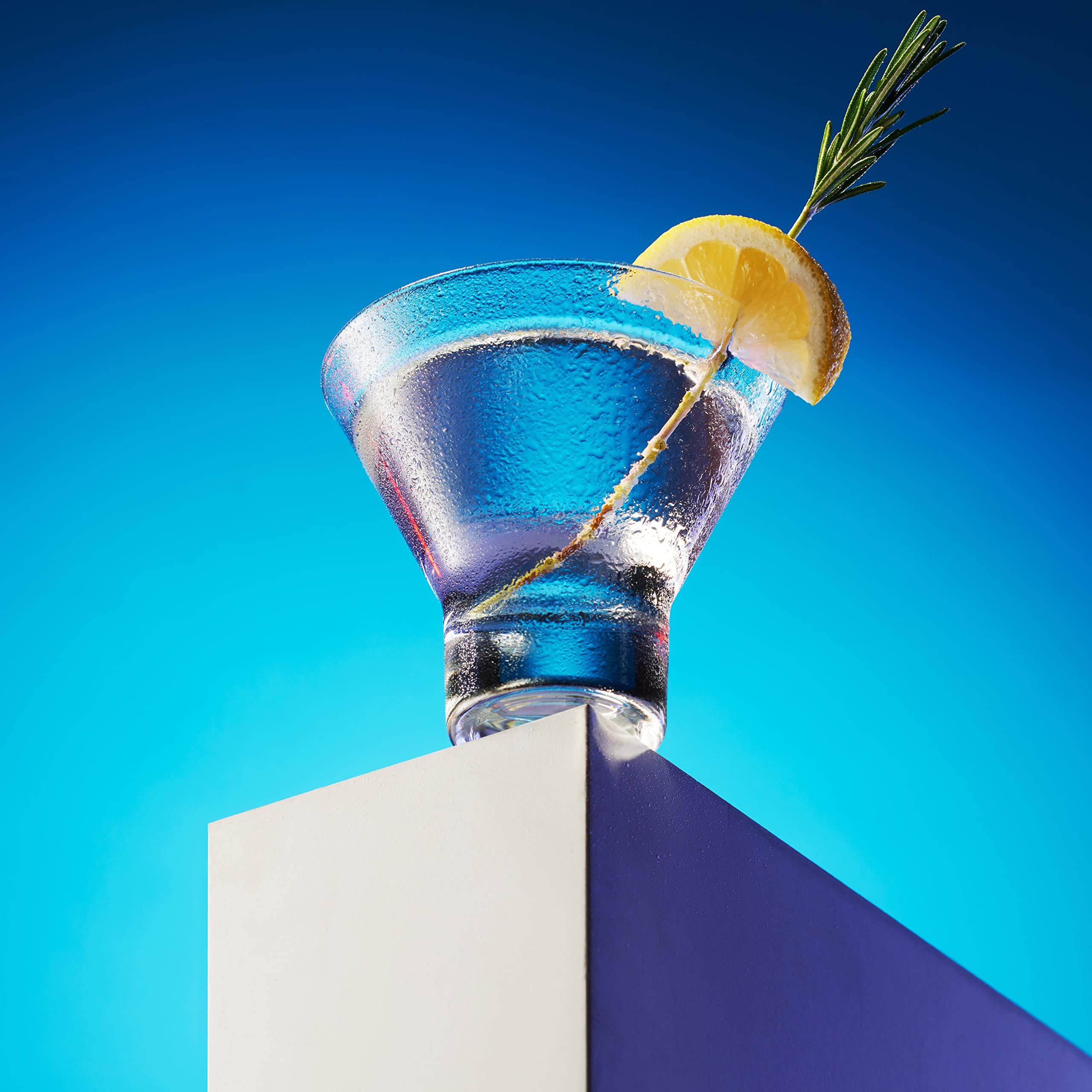 Godinger martini glasses with cocktail demonstrate ideal serving and presentation.