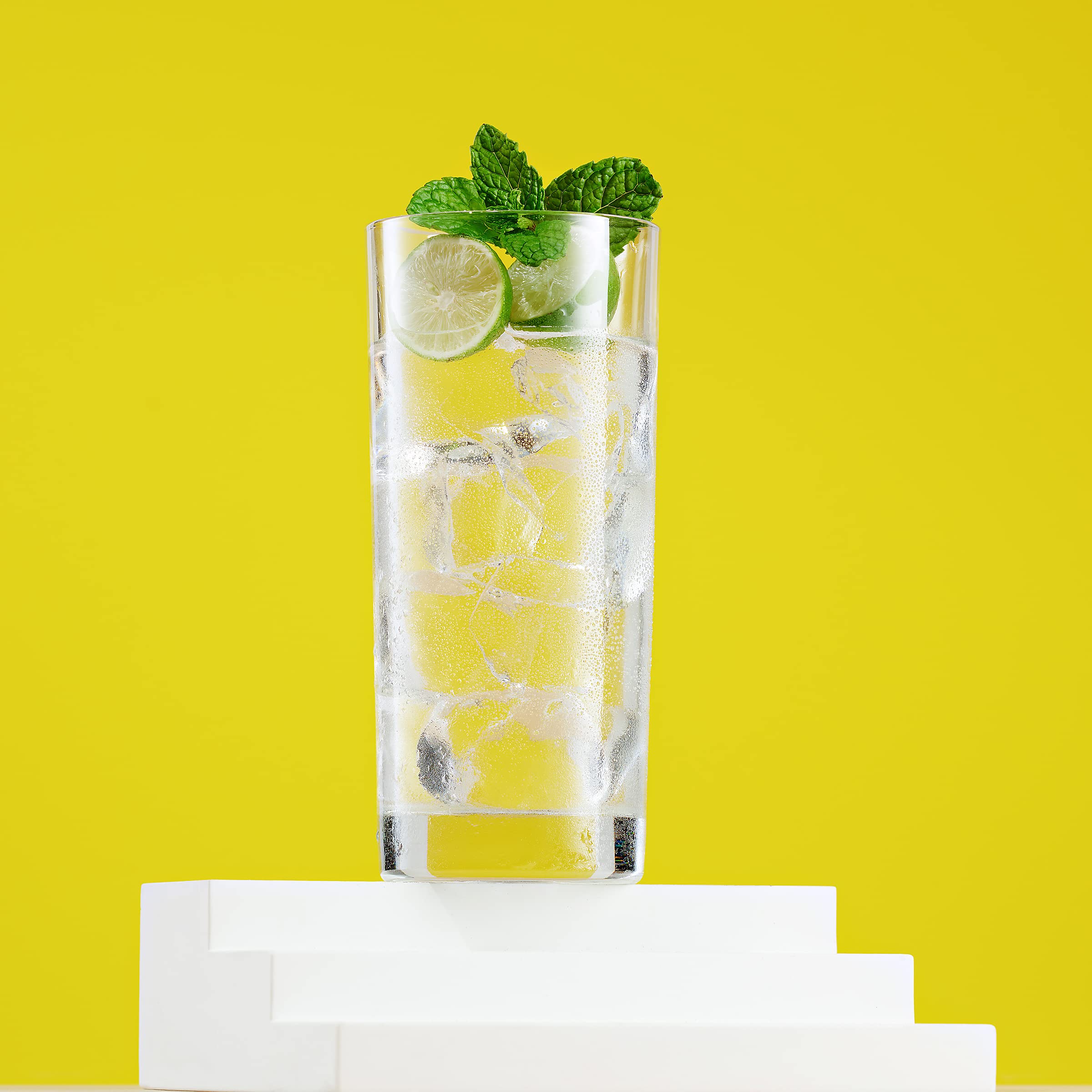 Godinger tall cylindrical glass with thick base for stable pouring.