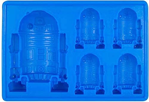 Gold INKU Han Solo silicone mold creates character-shaped chocolates and ice cubes.