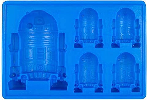 Gold INKU Han Solo silicone mold creates character-shaped chocolates and ice cubes.