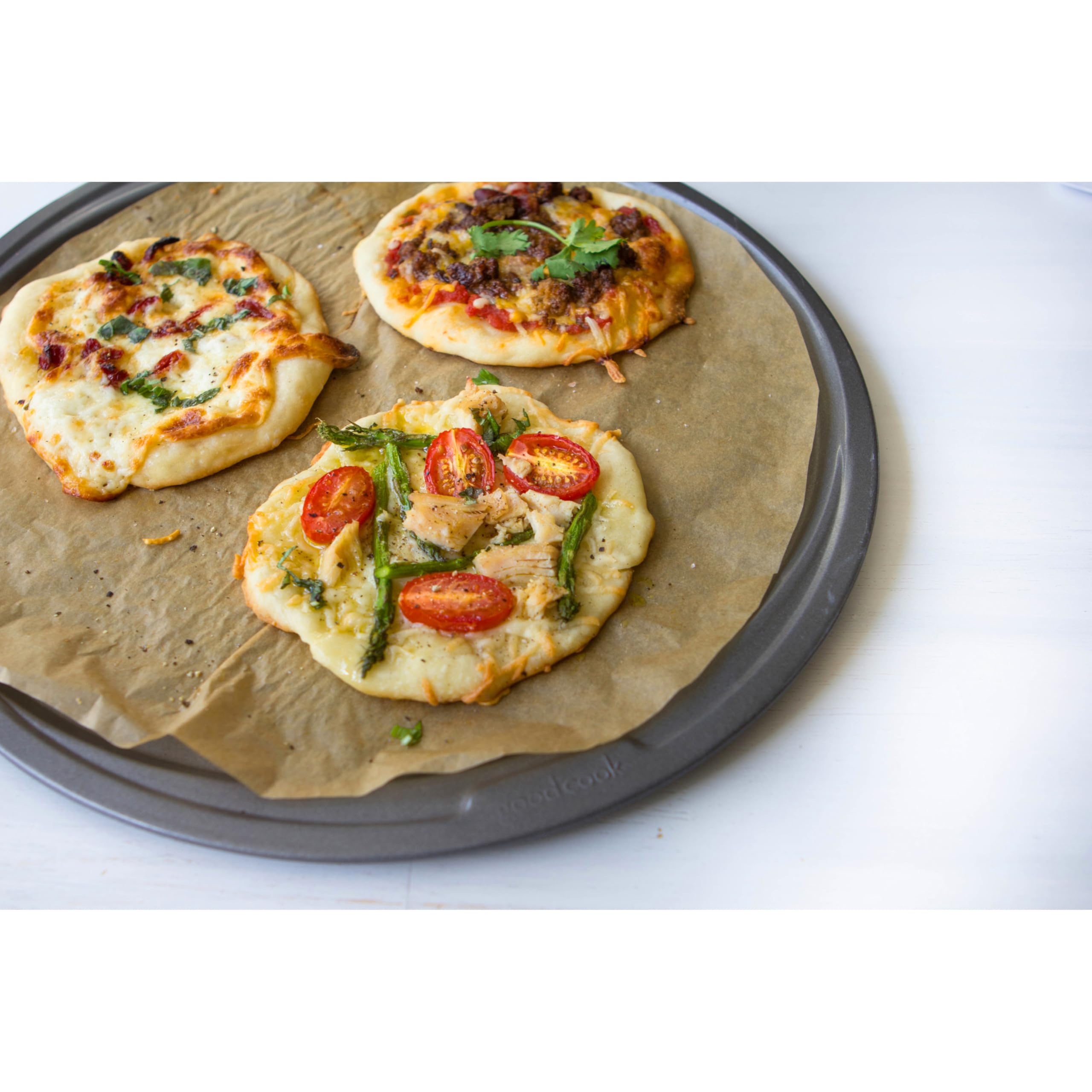 GoodCook gray finish pizza pan with wide rim for safe handling.