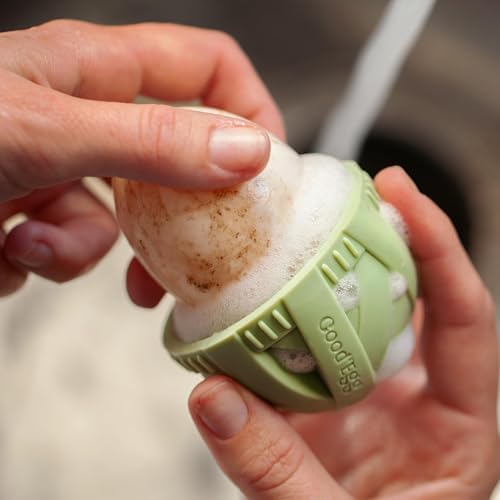 GoodEgg Original Egg Brush in use, gently rotating over egg under cool water