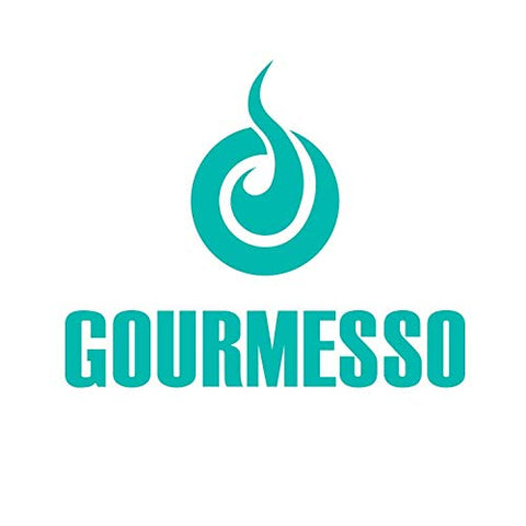 Gourmesso cleaning pod on a kitchen counter beside espresso cup.