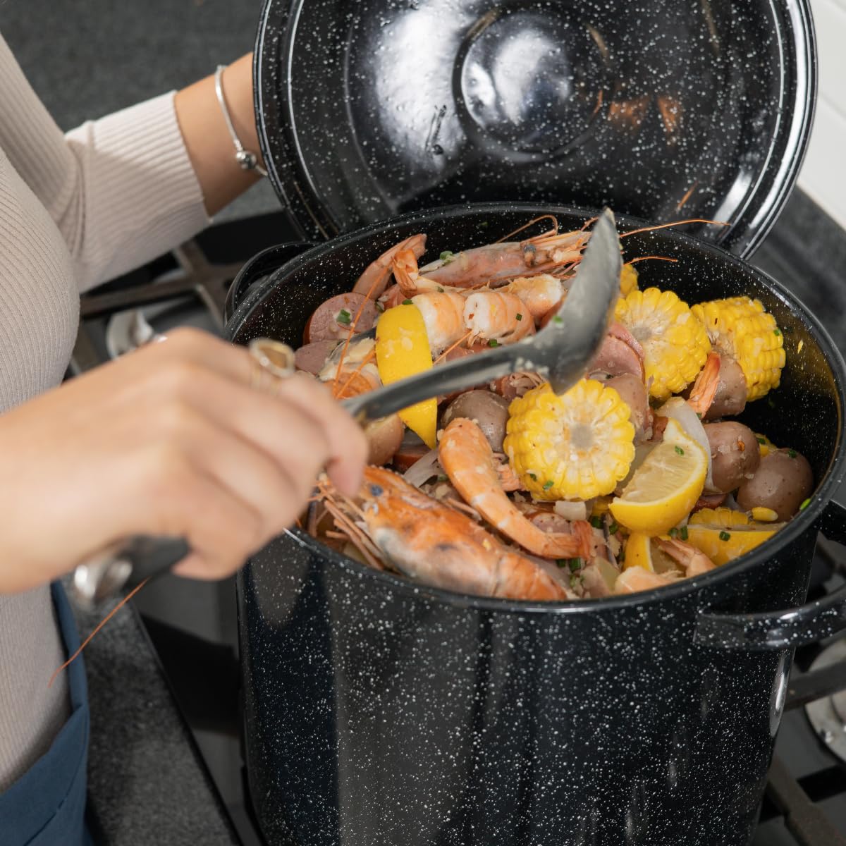 Granite Ware dimpled lid baste for moist, flavorful dishes.