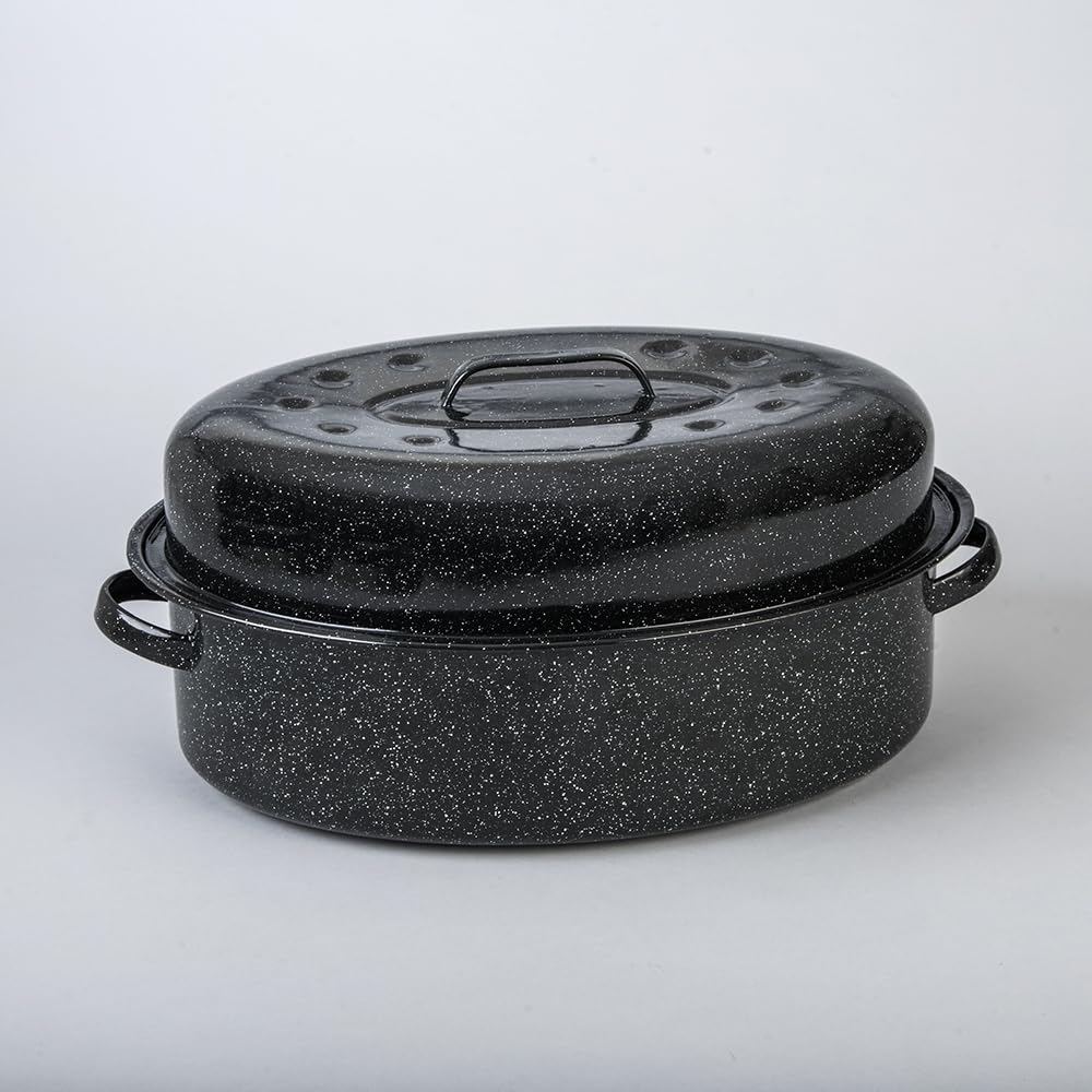 Granite Ware enamel roaster with speckled black finish highlights roasted vegetables.