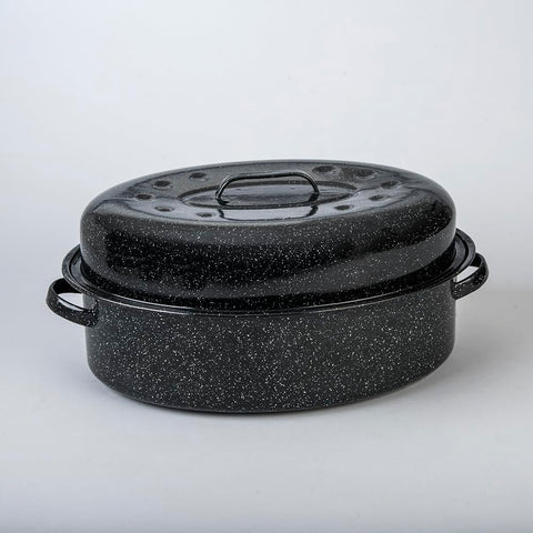 Granite Ware enamel roaster with speckled black finish highlights roasted vegetables.