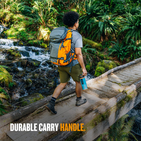GRAYL GeoPress bottle inside a backpack on a rugged trail