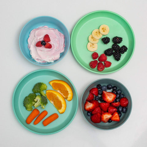 Grow Forward rainforest plates with high lip aid self-feeding and reducing spills.