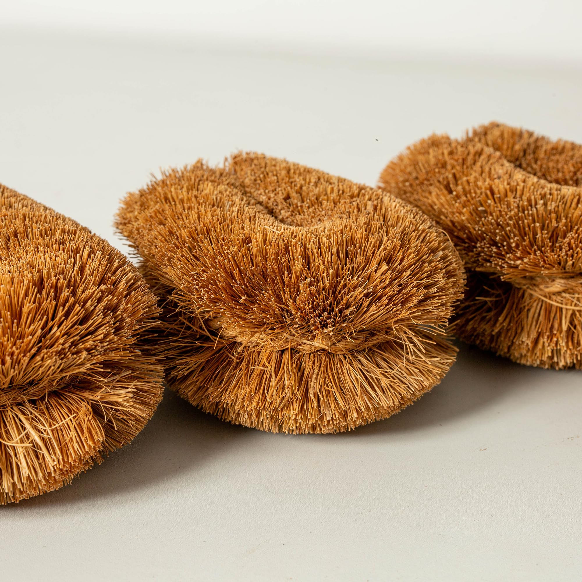 GrowByCoco vegetable-cleaning brush safely removes dirt from root vegetables.