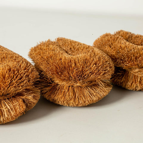 GrowByCoco vegetable-cleaning brush safely removes dirt from root vegetables.