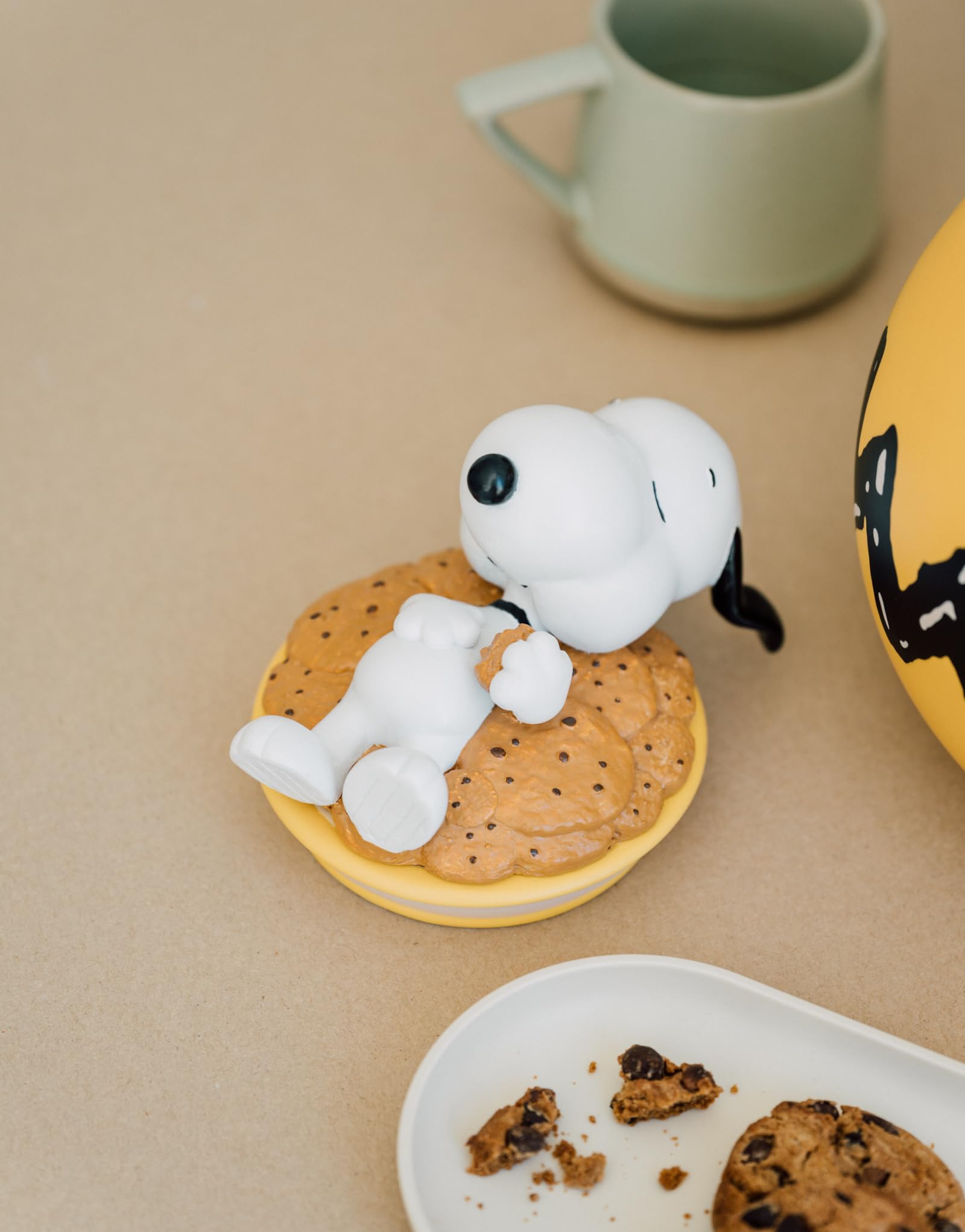 Grupo Erik Snoopy Cookie Jar on kitchen shelf complements Peanuts decor.