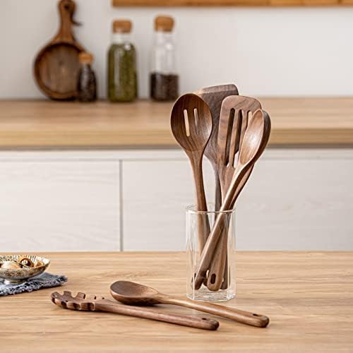 Gudamaye large slotted spatula lifting sautéed items with control.