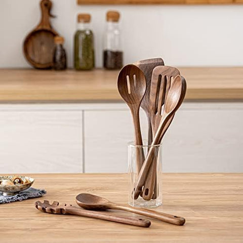 Gudamaye large slotted spatula lifting sautéed items with control.