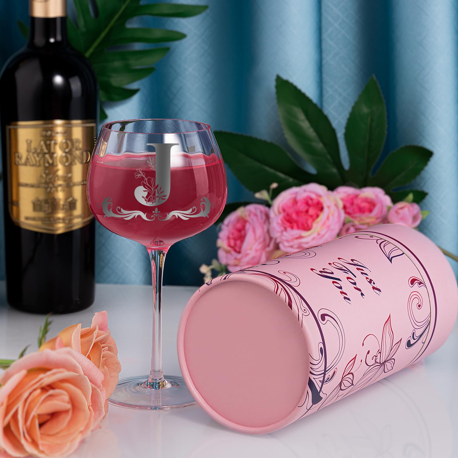Gumry wine glass embossed monogram highlights thoughtful personalization.