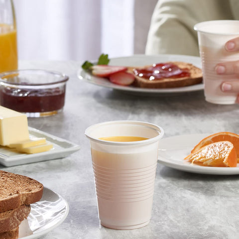 GUSTO Comfy 7oz white cups stacked neatly for quick restocking.