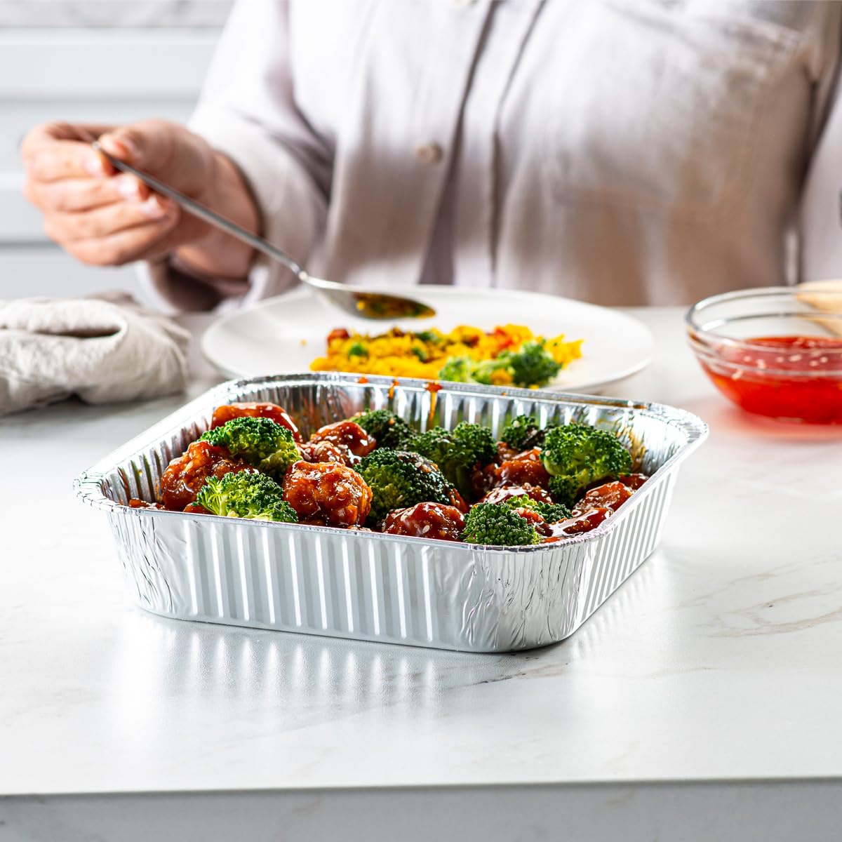 GUSTO stackable foil pans optimize storage without clutter.