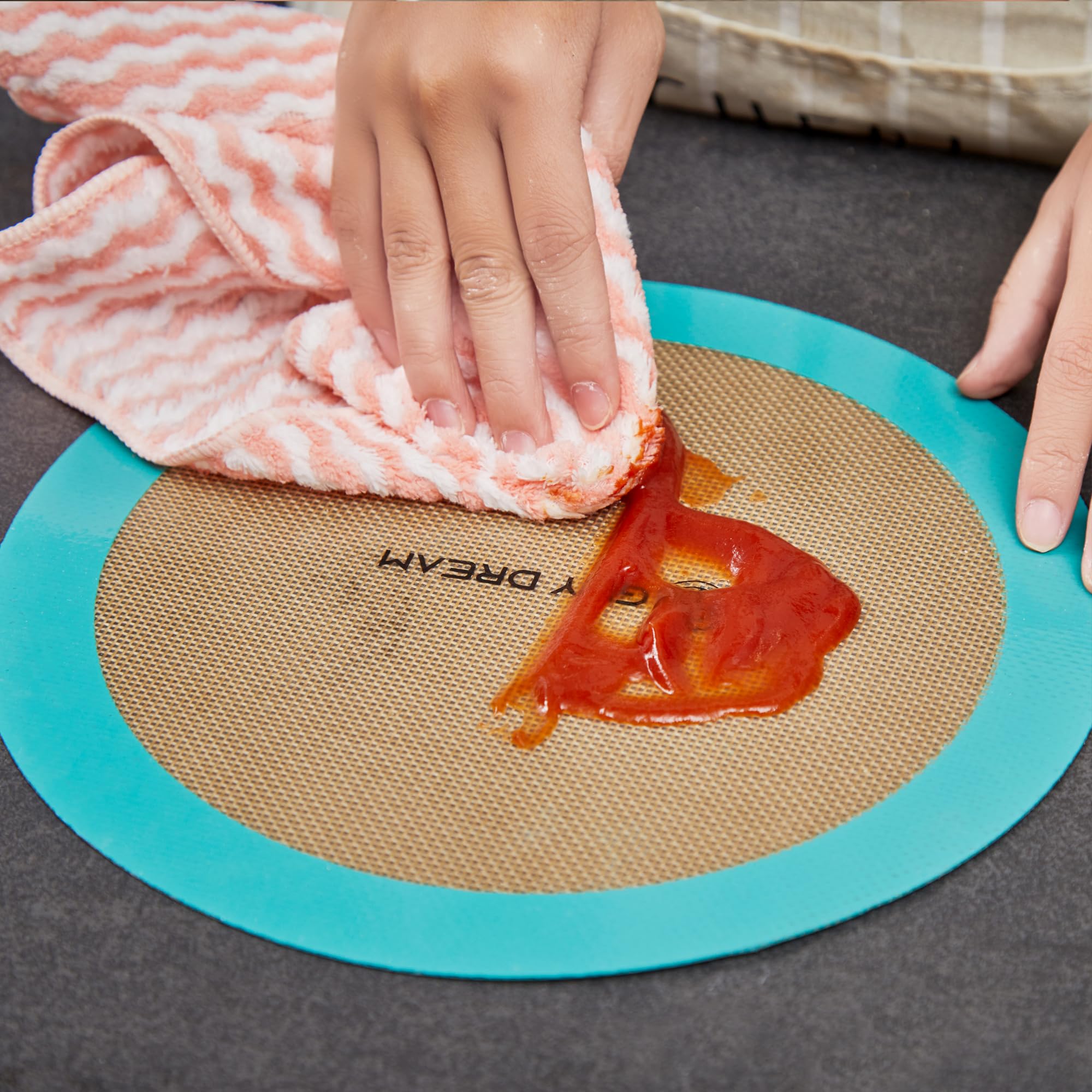 GUY.DRE.MAT foldable baking mat saving storage space in a kitchen.