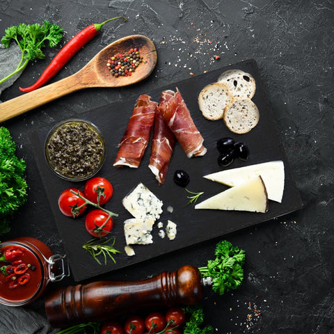 Hacaroa black charcuterie stone plate for gourmet spreads.