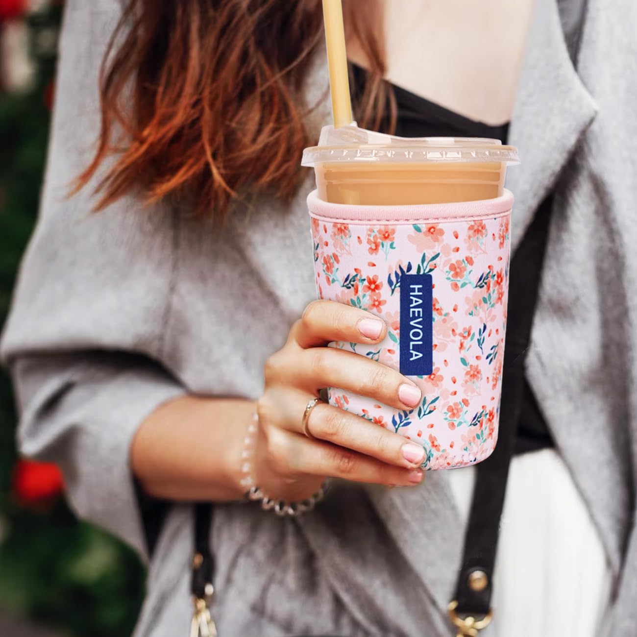 Haevola blush ditsy sleeve design protects hands from condensation during iced coffee.