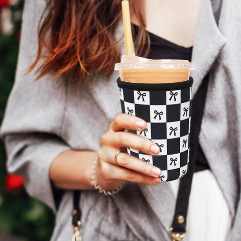 Haevola neoprene sleeve three-pack on display showcasing exclusive designs for stylish beverages.