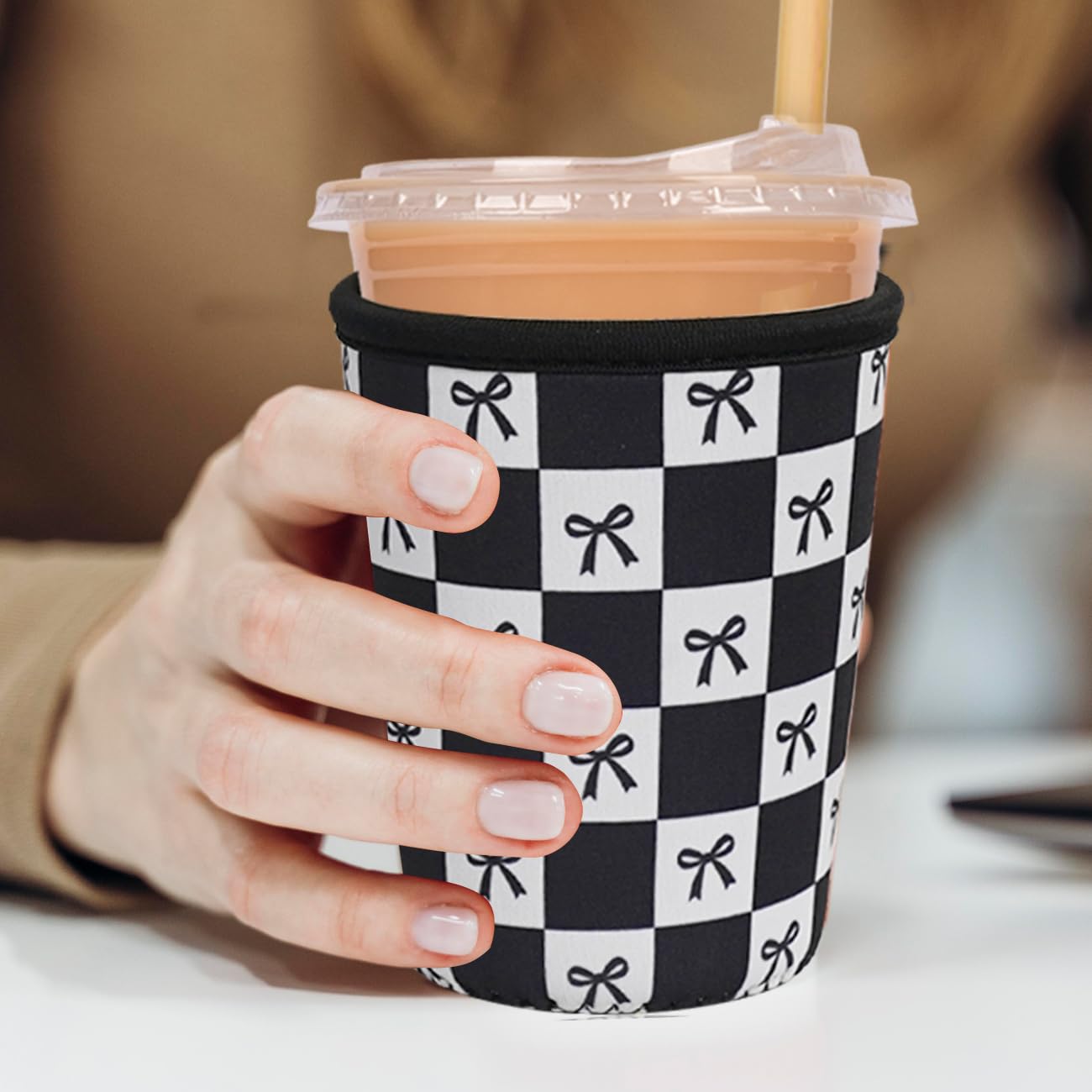 Haevola neoprene sleeve wrapped on cup demonstrates versatile fit for various cup sizes.