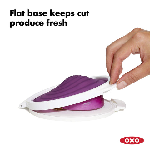 Half onion lies cut-side down in the saver for longevity.