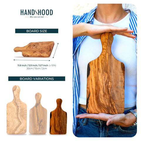 HandsHood close-up of olive wood grain pattern on board