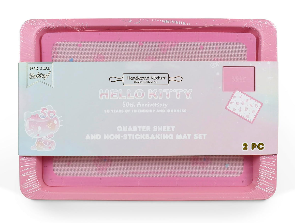 Handstand Kitchen Hello Kitty baking sheet with 50th anniversary pink finish, perfect for cookies.