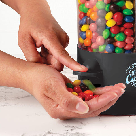 Handy Gourmet Triple Candy Machine in action with fingertip dispensing for easy snacking
