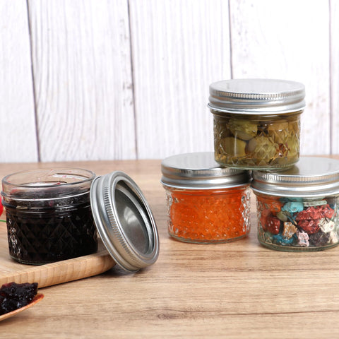 Haneye mini mason jars used as elegant wedding favors.