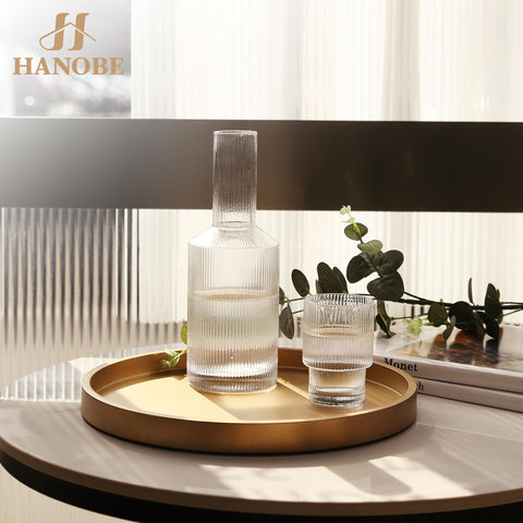 Hanobe candle-holder display tray keeps remotes and small items organized on a coffee table.