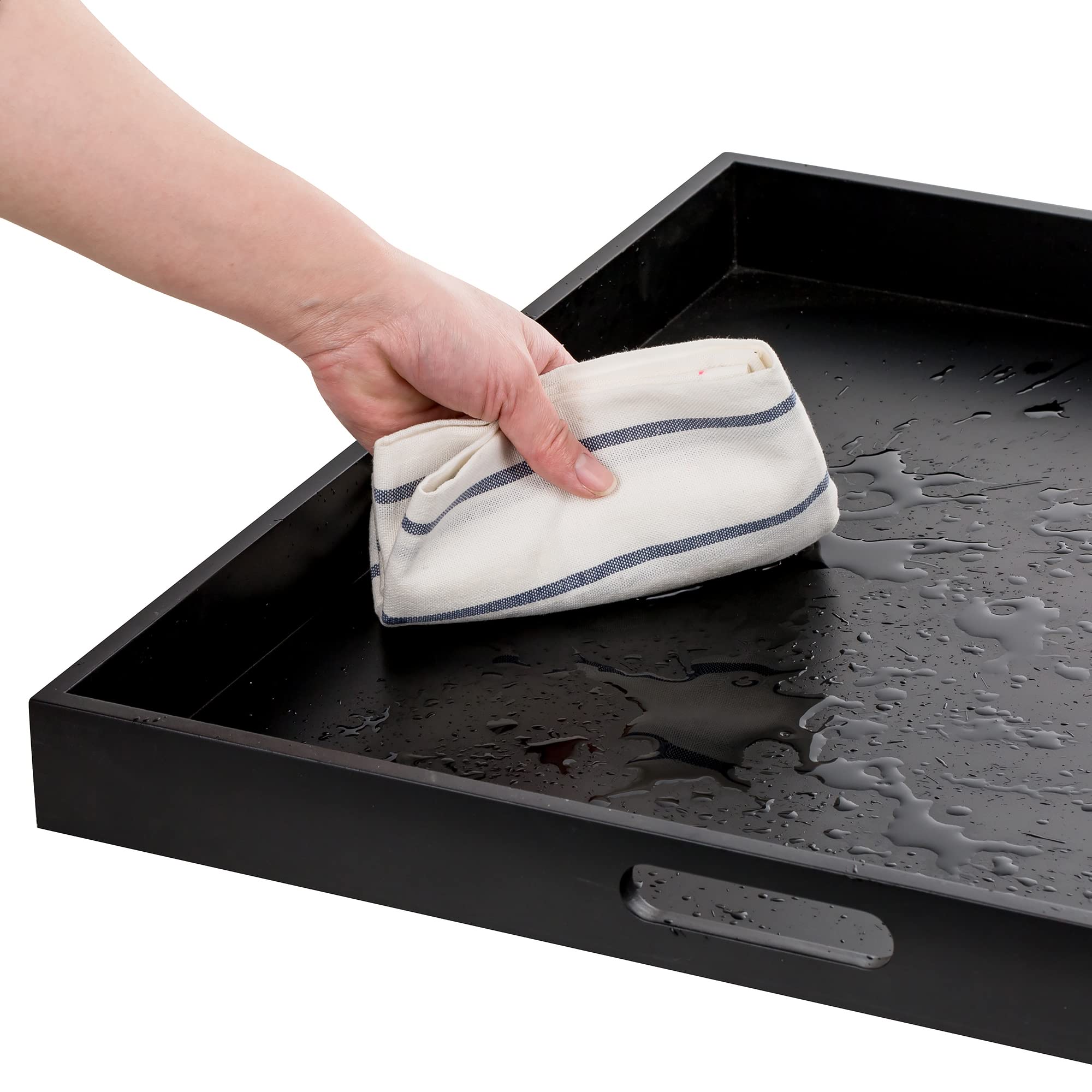 Hanobe tray keeps remotes, magazines organized on coffee table.