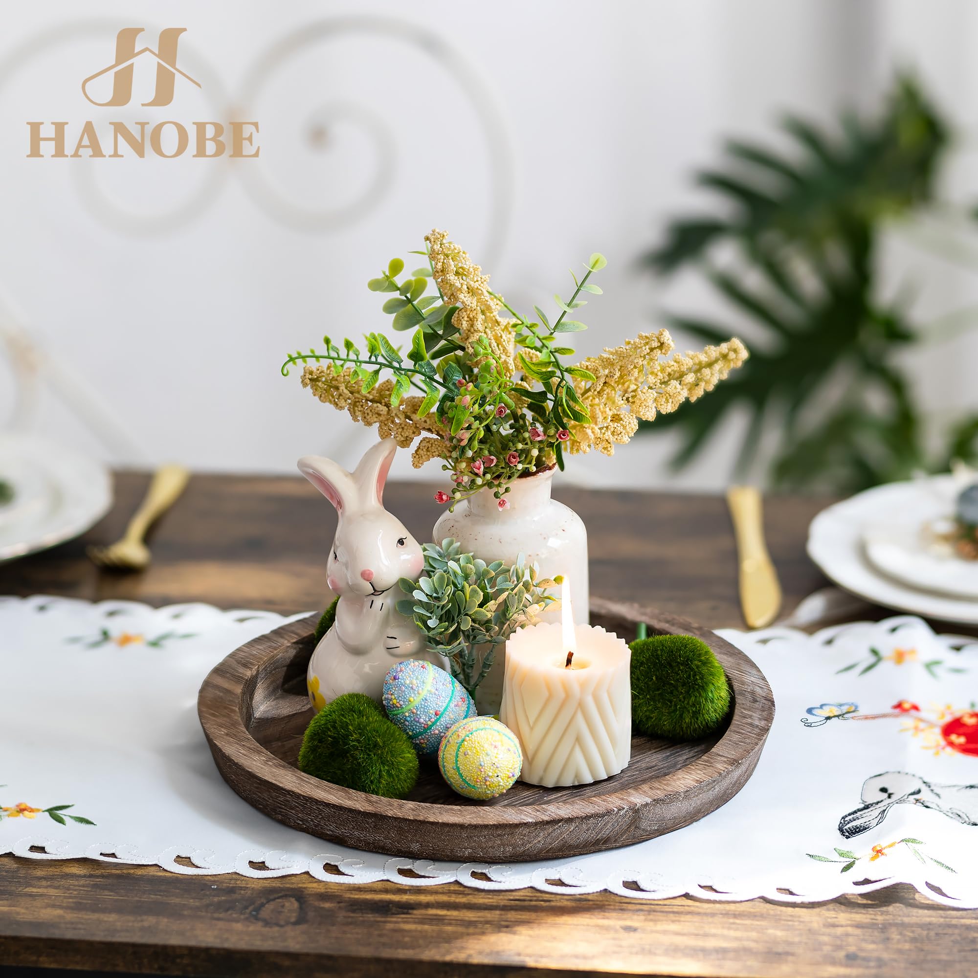 Hanobe round wood tray with distressed finish enhances vintage farmhouse decor.